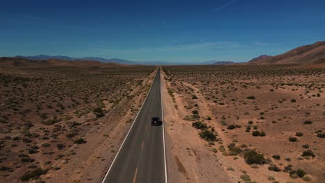 Modern-car-driving-on-desert-highway-in-Nevada