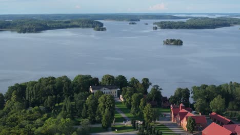 Aerial---Sideway-drone-view-of-lake-off-Taxinge-castle-in-Stockholm,-Sweden