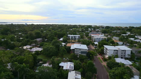 Aerial-Drone-Spin-Quite-Residential-Suburb-City-to-Surf-Coast-Beach-Oceanside-Living-with-River-Rapid-Creek-NT-Australia