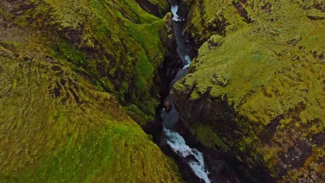 Birdeye-view-drone-shot-of-Fjaðrárgljúfur-a-stunning-canyon-in-Iceland-during-summer-time