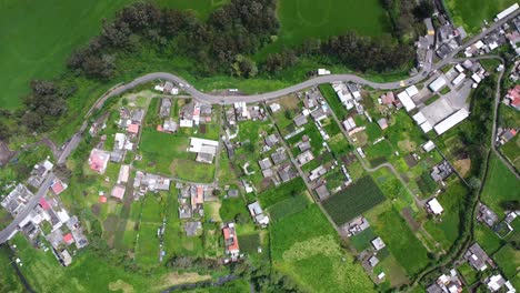 Village-homestead-farms-lush-green-arable-land-Ecuador-AERIAL-VIEW