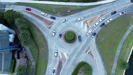 Drone-aerial-view-of-cars-driving-around-Gosford-waterfront-roundabout-stadium-transportation-infrastructure-Central-Coast-Australia