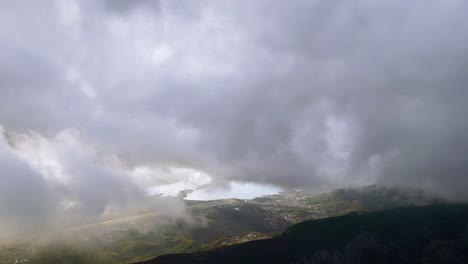Flying-Towards-Bay-of-Kotor,-Aerial-Panorama-with-Stormy-Skies,-Montenegro-Wild-Beauty