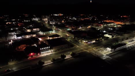 Downtown-Kingman,-Arizona-at-night-with-drone-video-moving-in-a-circle