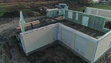 Aerial-of-prefabricated-modular-house-walls-under-construction-in-new-housing-estate