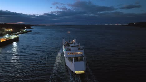 An-aerial-view-of-the-Port-Jefferson-ferry-departing-during-a-colorful-and-cloudy-sunset