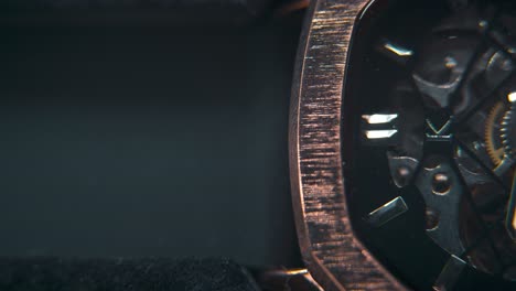 A-macro-slose-up-shot-of-a-mechanic-hand-watch,-vintage-technology,-retro-mechanism,-octagon-goden-design,-cinematic-studio-lighting,-commercial-footage,-smooth-detailet-4K-video,-pan-right