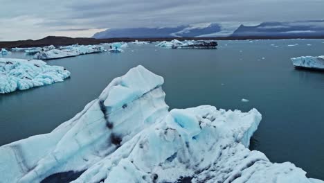 Close-orbit-drone-shot-of-iceberg-in-Jökulsárlón-the-glacier-lagoon-in-Iceland