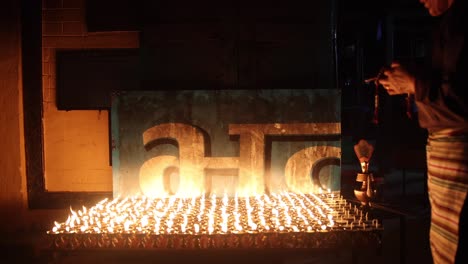 Video-of-lit-candles-at-the-Buddhist-site-of-Boudhanath,-Kathmandu,-Nepal