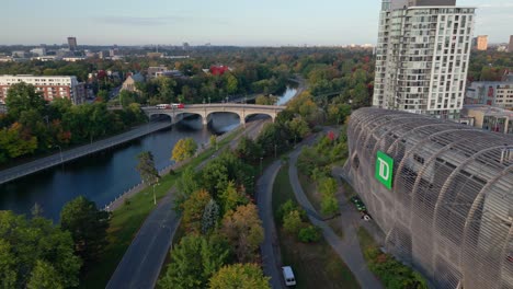 Drone-aerial-landscape-view-of-TD-Place-stadium-sports-field-river-park-walkway-Rideau-Canal-Lansdowne-Park-Ottawa-Canada