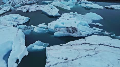 Orbit-drone-shot-of-Jökulsárlón-the-glacier-lagoon-Iceland-in-summer