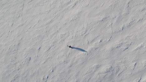 Top-Down-View-Of-Skier-On-Ski-Slope-In-Saalbach-Hinterglemm,-Austria---Drone-Shot