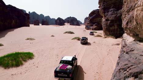 Driving-through-the-huge-stone-mountains-of-the-Sahara-Desert-at-midday