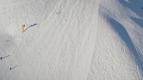 Skiers-At-Ski-Resort-In-Saalbach-Hinterglemm,-Austria---Aerial-Drone-Shot