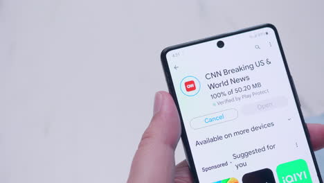 Downloading-and-installing-a-new-CNN-World-News-application-on-a-mobile-smart-phone
