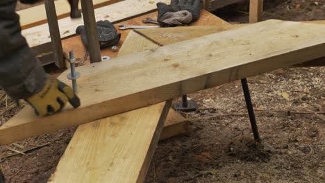 Construction-of-roof-frame,-man-hitting-hammer