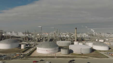 An-aerial-view,-moving-from-left-to-right,-of-an-oil-refinery-and-storage-tanks-located-on-Hwy-225-in-Deer-Park,-Texas
