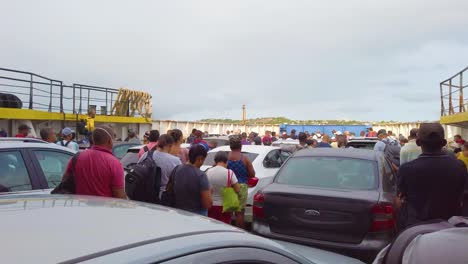 Ferry-boat-filled-with-cars,-people-wait-for-the-gates-to-open