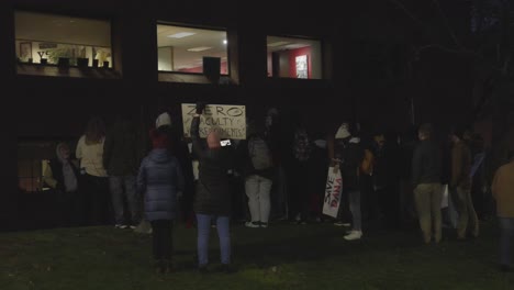 Students-gather-at-Youngstown-State-University-in-Youngstown,-Ohio-at-The-Dana-School-of-Music-holding-signs-in-protest-to-the-cuts-to-the-arts-program