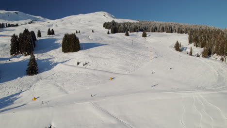 Freeriders-Skiing-Downhill-On-Snowy-Slope-Of-Mountain-Reiterkogel-In-Austria
