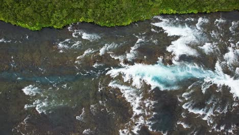 Iconic-Bruarfoss-Waterfall-and-flowing-river-in-Iceland,-aerial-drone-view