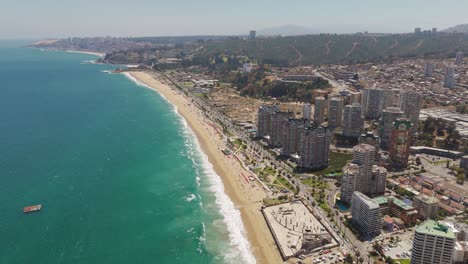 Aerial-High-Angle-View-Overlooking-Blanca-Beach-With-Resort-Apartments-in-Vina-del-Mar
