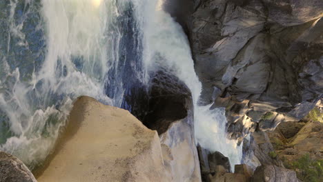 Vertical---River-Rapids-Through-Boulders-At-God's-Bath-Swimming-Basin-On-Clavey-River-In-California