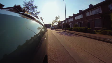 Car-mount-on-right-side-of-vehicle-with-late-afternoon-sunlight-ride-in-street