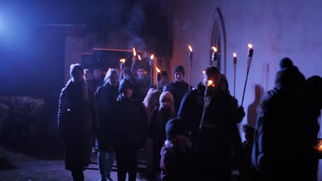 People-with-torches-march-through-the-city,-Memorial-Day-of-the-Fallen-Soldiers
