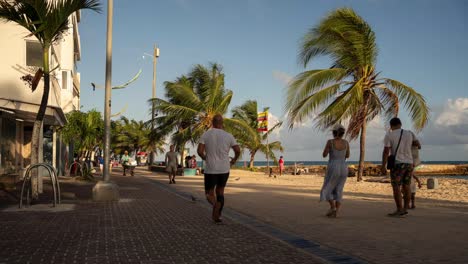 Timelapse-People-Walking-At-Beach-Sidewalk-in-the-Morning
