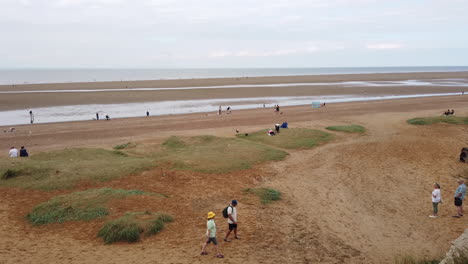 People-enjoying-early-autumn-on-Hunstanton-beach-on-the-Norfolk-county-coast-while-the-tide-is-out