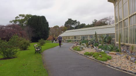 Tourists-Walking-On-The-Pathway-Inside-The-National-Botanic-Gardens-In-Dublin,-Ireland