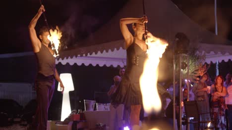Fiery-Jugglers'-Nocturnal-Ballet:-Enchanting-Display-of-Flaming-Baton-Mastery