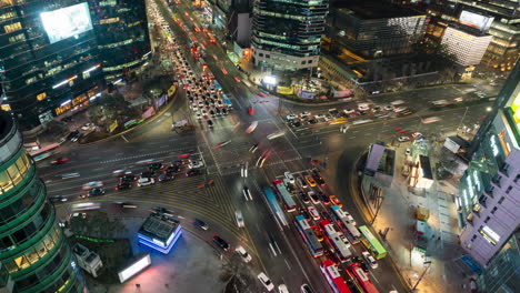 Night-Traffic-Timelapse-at-Gangnam-Station-Crossroad---aerial-top-down-view