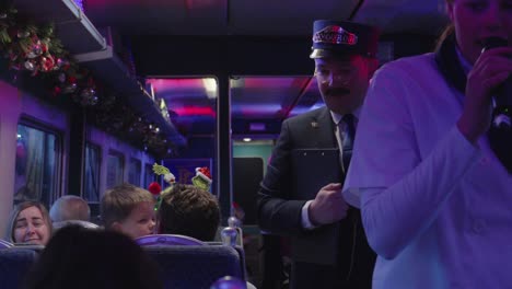 Entertainers-on-Polar-Express-train-ride-performing-for-watching-passengers