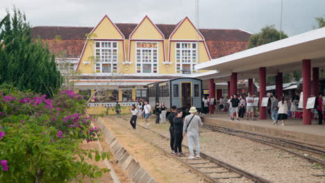 Da-Lat-Train-Station---Groups-of-Tourists-Walking-Near-Train-on-Railway-Tracks-Sightseeing-Old-Railway