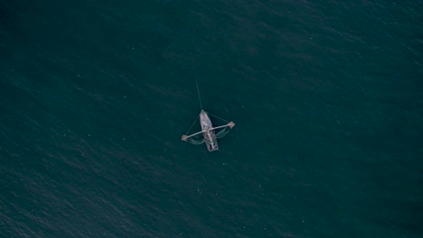 Aerial-shot-overhead-of-shrimp-boat-fishing-at-sea