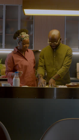 Mature-couple-playing-in-the-kitchen