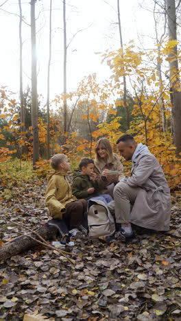 Family-sitting-around-a-dead-tree