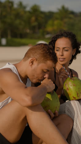 Couple-enjoying-coconut-drink