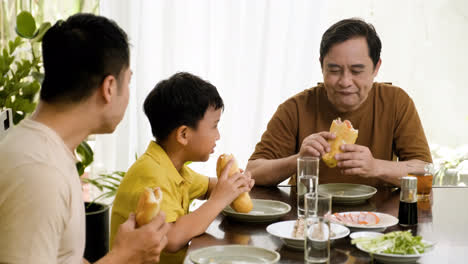 Asian-men-and-boy-sitting-at-the-table