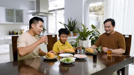 Asian-men-and-boy-sitting-at-the-table