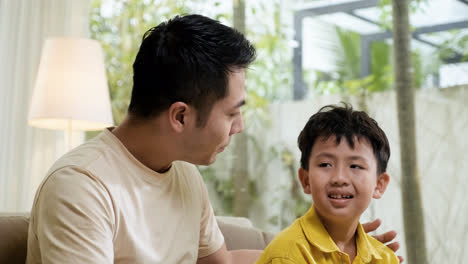 Asian-man-and-boy-in-the-living-room
