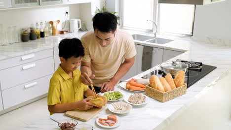 Asian-man-and-boy-in-the-kitchen