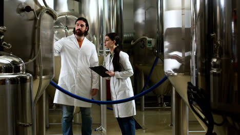 Man-and-woman-doing-control-at-brewery