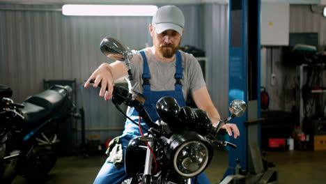 Young-man-with-cap-riding-at-the-garage