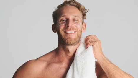Handsome-strong-guy-with-eye-patches-and-towel