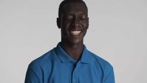 Happy-African-american-man-on-grey-background.