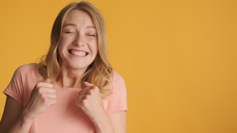 Caucasian-woman-getting-excited-and-showing-thumbs-up-on-camera.