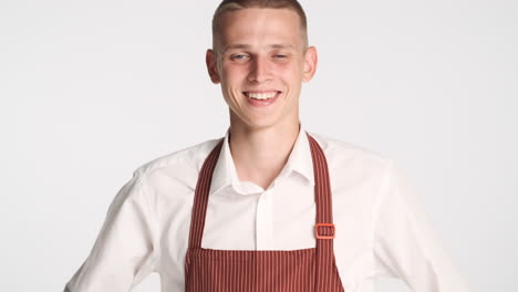 Young-waiter-smiling-and-posing